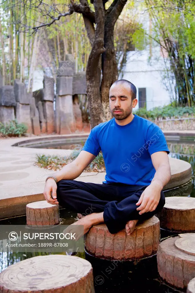 Man Meditates In Lotus Position;Kunming Yunnan China