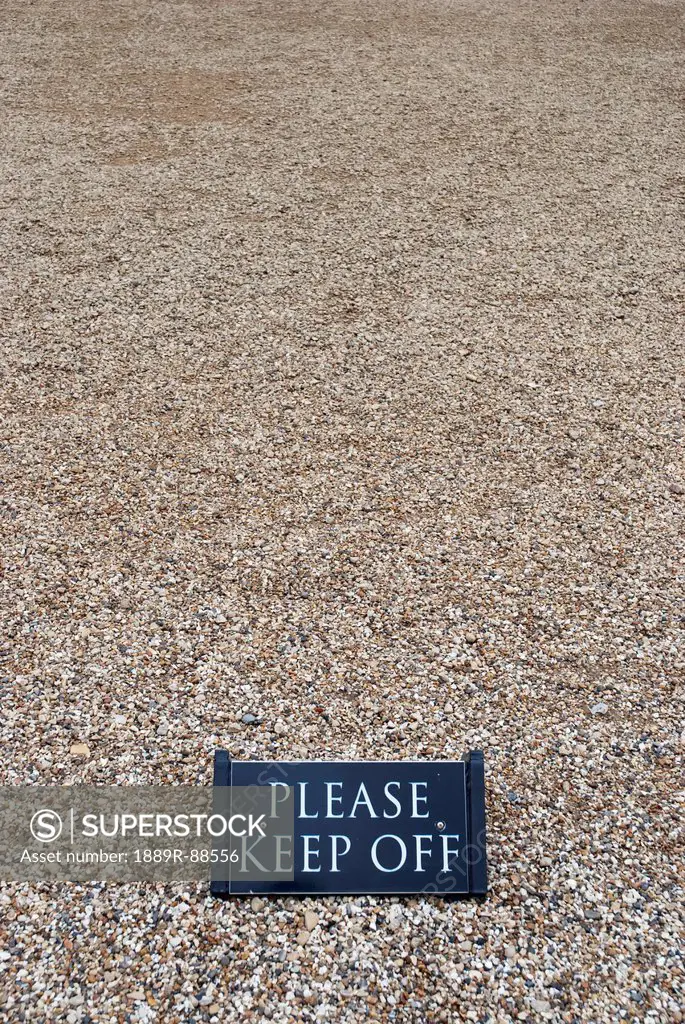 Keep off sign over pebbles at blenheim palace;Woodstock oxfordshire england
