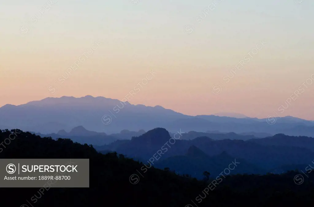 Silhouetted layers of mountains in shan state burma;Pai thailand