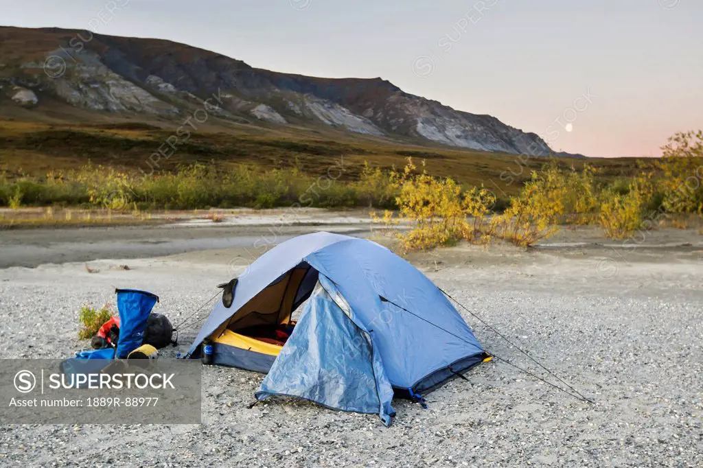 A tent set up with a view of the brooks range gates of the arctic national park northwestern alaska;Alaska united states of america