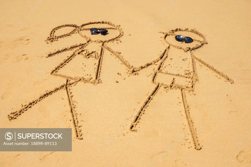 Drawing of a couple in the sand in praia do bode;Fernando de noronha pernambuco brazil
