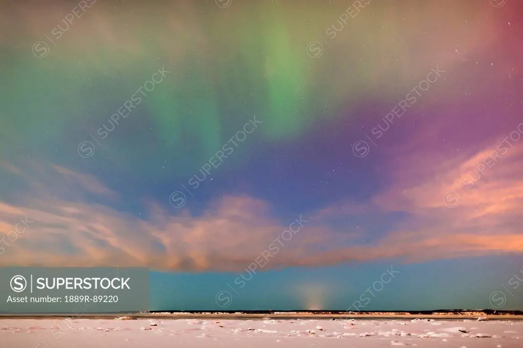 The northern lights in the night sky above knik arm from the tony knowles coastal trail in winter;Anchorage alaska united states of america