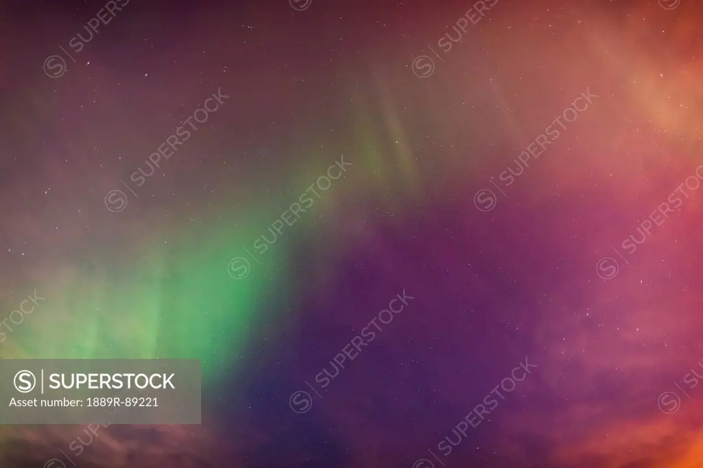 A green northern lights corona in the sky above the tony knowles coastal trail in winter;Anchorage alaska united states of america