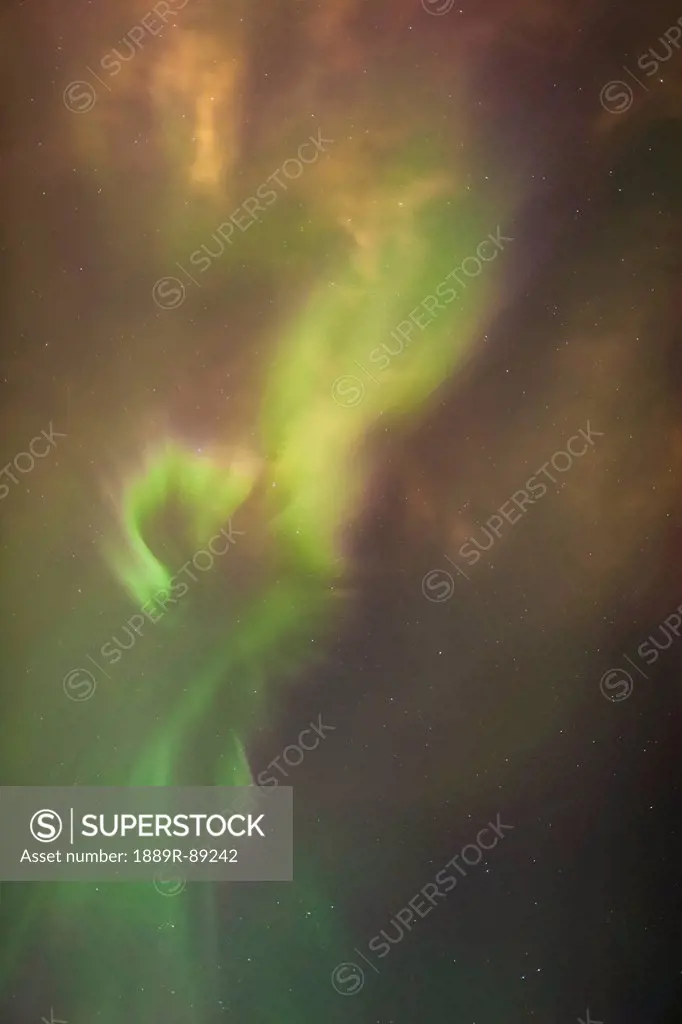 The aurora borealis corona in the sky above the tony knowles coastal trail in winter at nighttime;Anchorage alaska united states of america