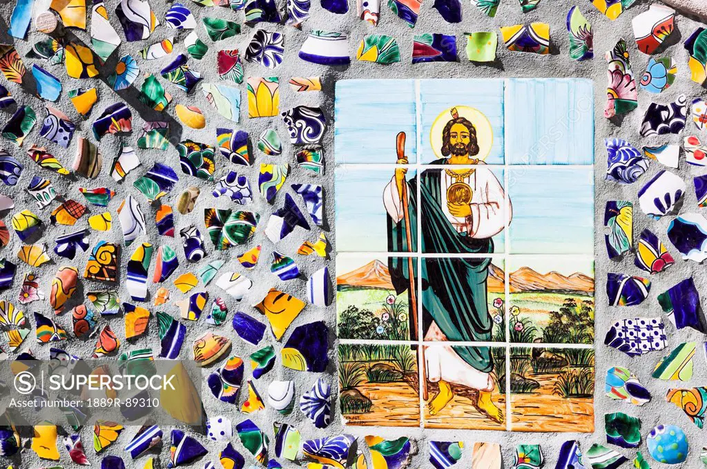 Jesus is depicted in a colour tile mosiac on a street;Puerto vallarta mexico