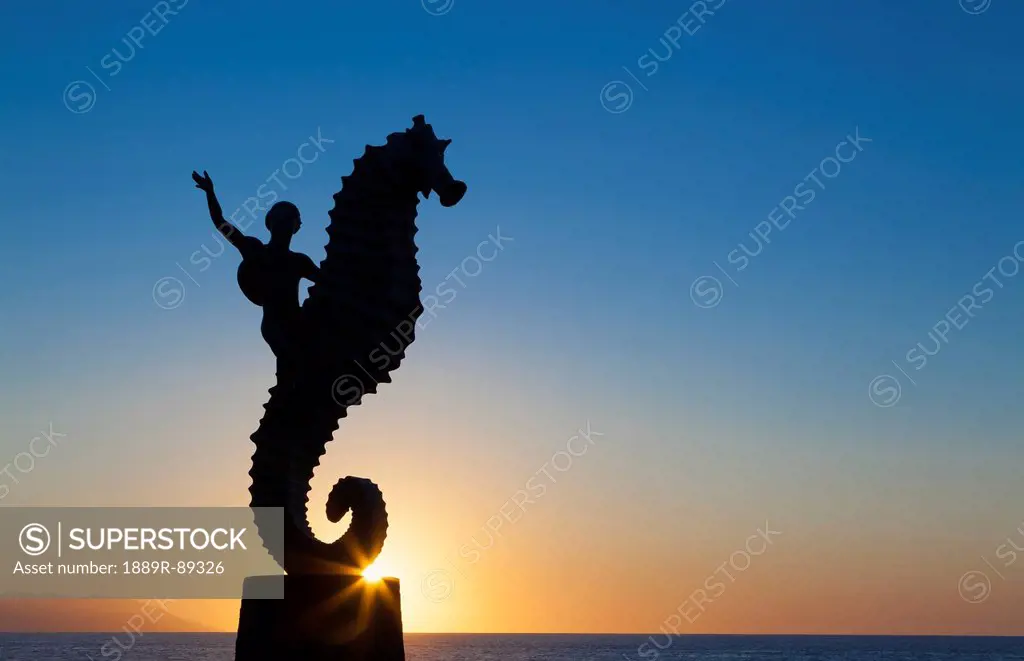 The seahorse sculpture on the malecon at sunset;Puerto vallarta mexico