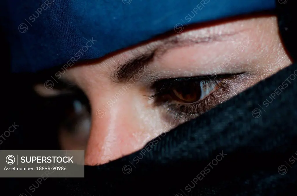 A woman wearing a hijab with only her eyes showing;Locarno ticino switzerland