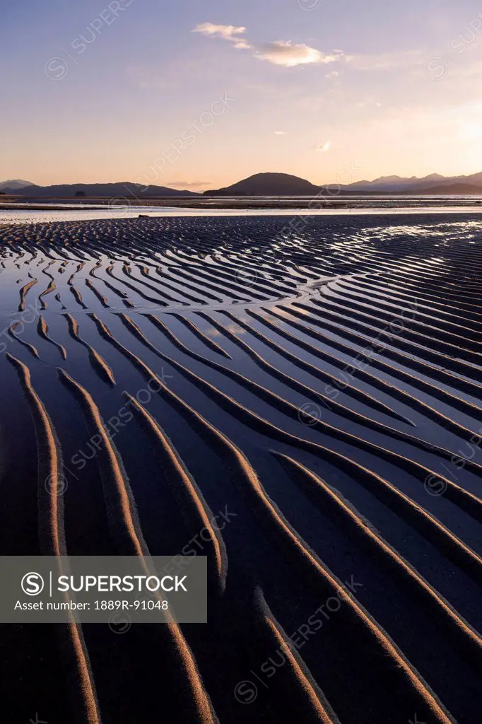 Ripples are revealed as the evening tide recedes eagle beach state recreation area near juneau;Alaska united states of america