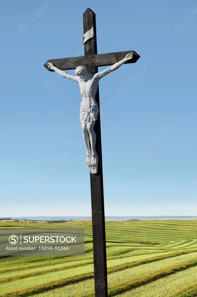 A crucifix on farmland; Saskatchewan, Canada