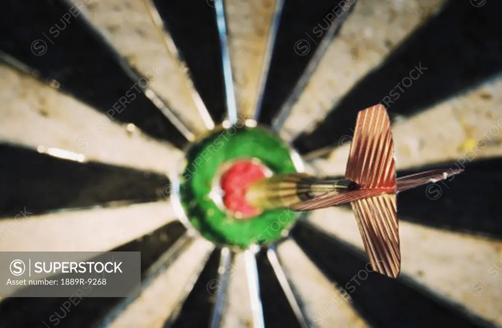 Dart in bulls eye of target