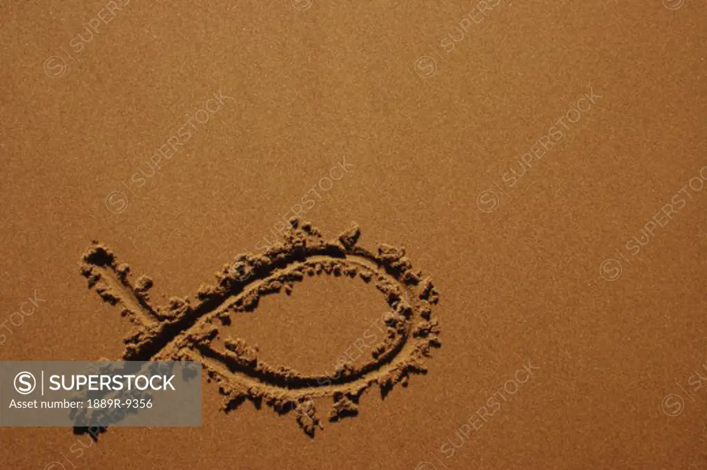 Fish symbol in sand