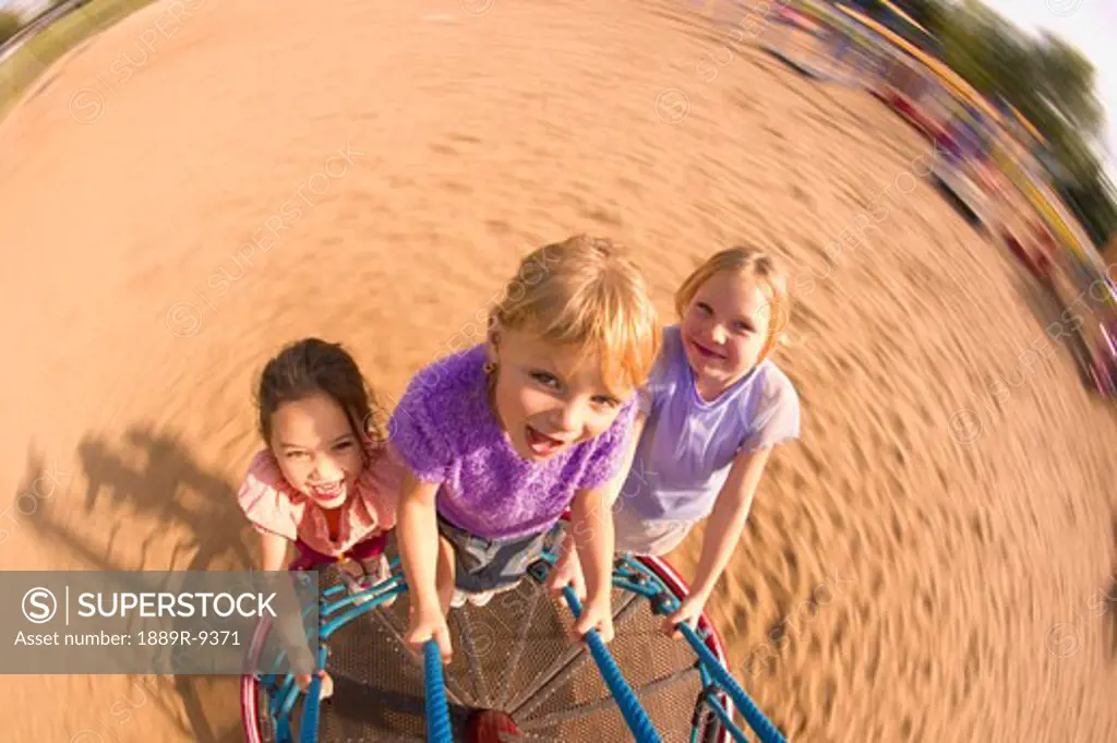 Children spinning on playground