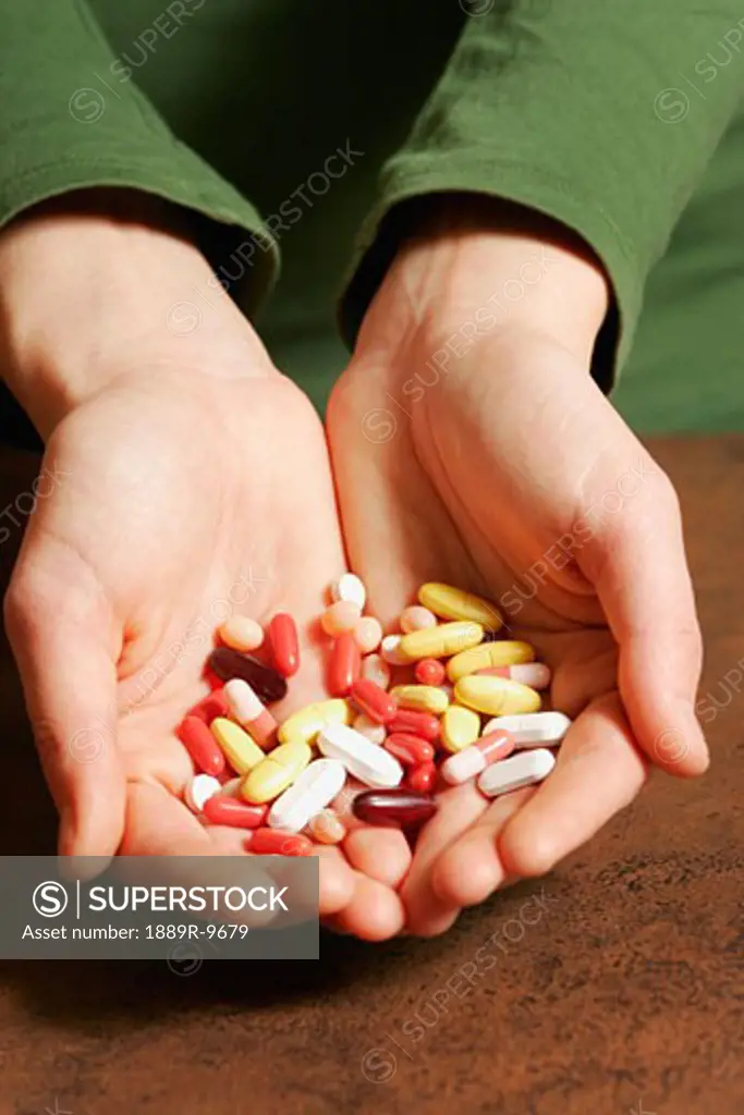 Hands full of pills