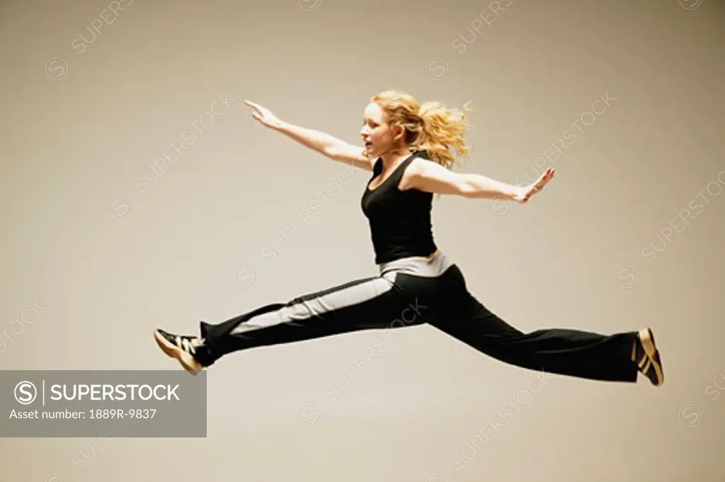Woman leaps in the air
