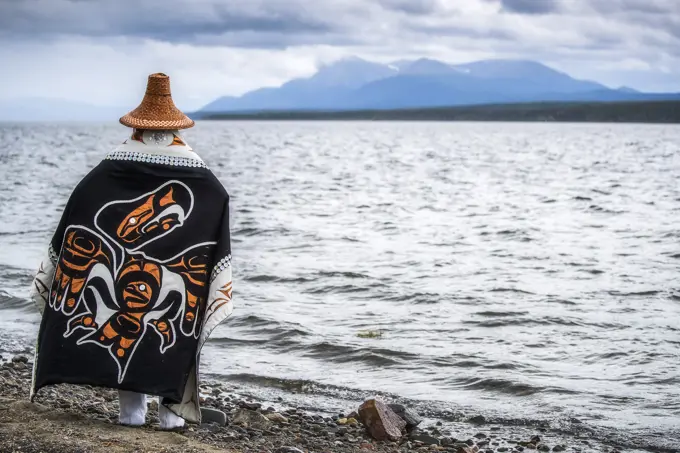 Tlingit woman in traditional attire on the shores of Teslin Lake; Teslin, Yukon, Canada
