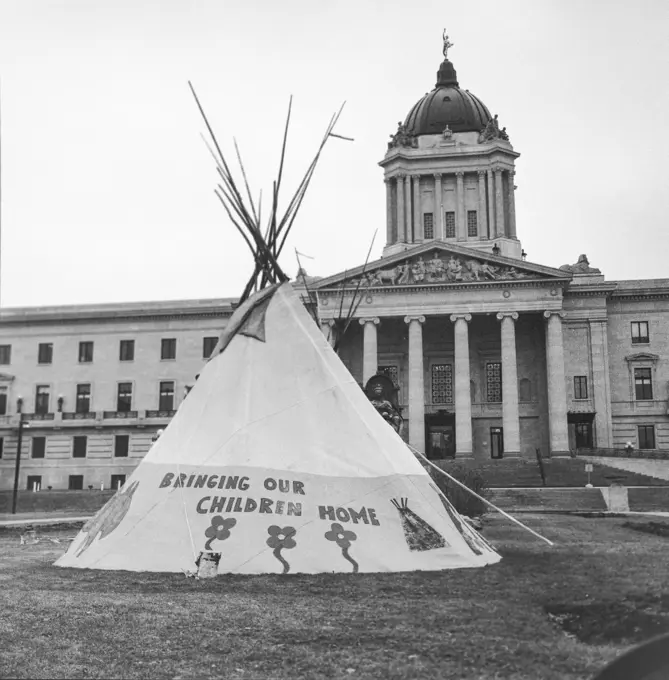 Tipi with the inscription 'Bringing Our Children Home' on the Manitoba Legistlative Grounds; Winnipeg, Manitoba, Canada