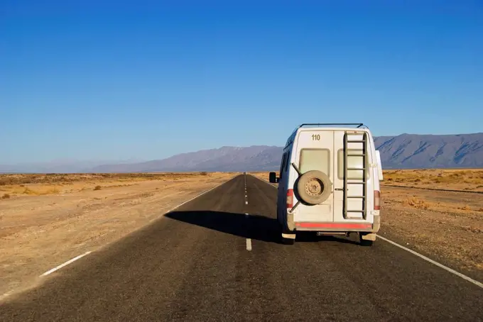 camper van on a road outside cafayate, salta, argentina