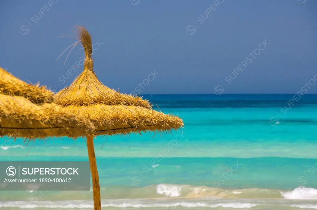 Parasols on beach, Rethymno, Crete, Greek Islands, Greece, Europe