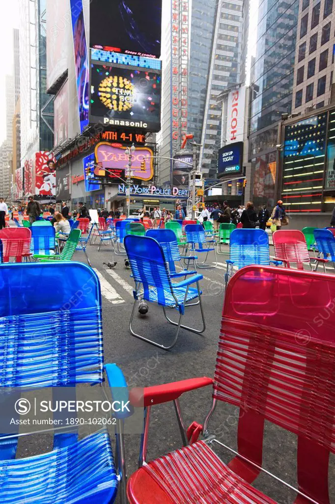 Garden chairs in the road for the public to sit in the pedestrian zone of Times Square, Manhattan, New York City, New York, United States of America, ...