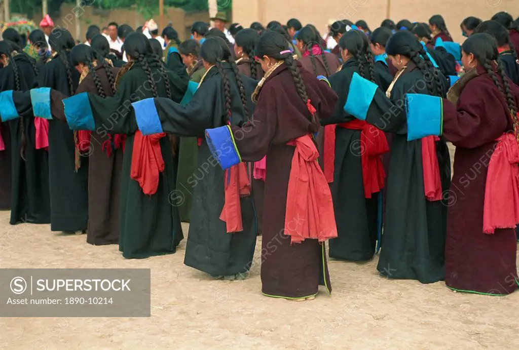 Tibetan women dancing during secular festival, Tongren, Qinghai, China, Asia