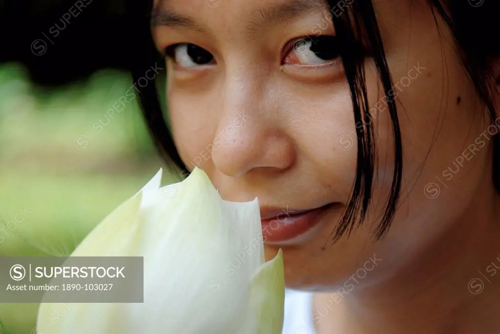 Woman with lotus flower, Vietnam, Indochina, Southeast Asia, Asia