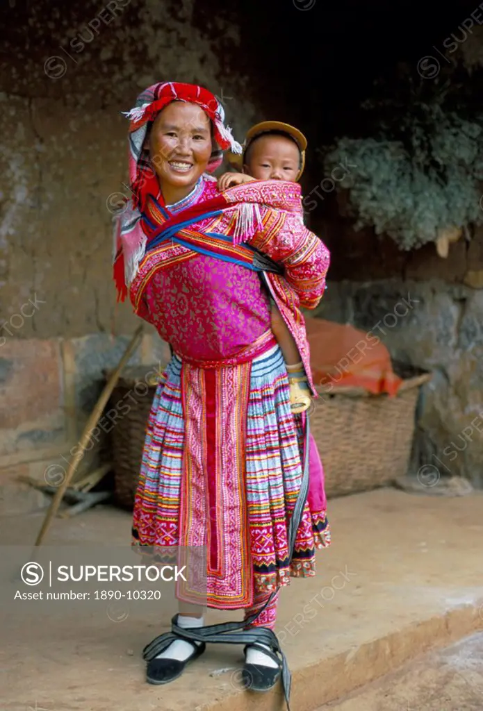 Portrait of a Miao girl with baby carrier, Qiubei, Yunnan, China, Asia