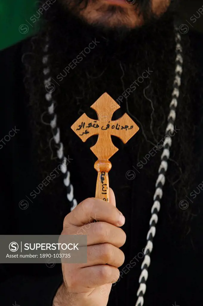 Egyptian Orthodox Coptic priest showing cross, Jerusalem, Israel, Middle East
