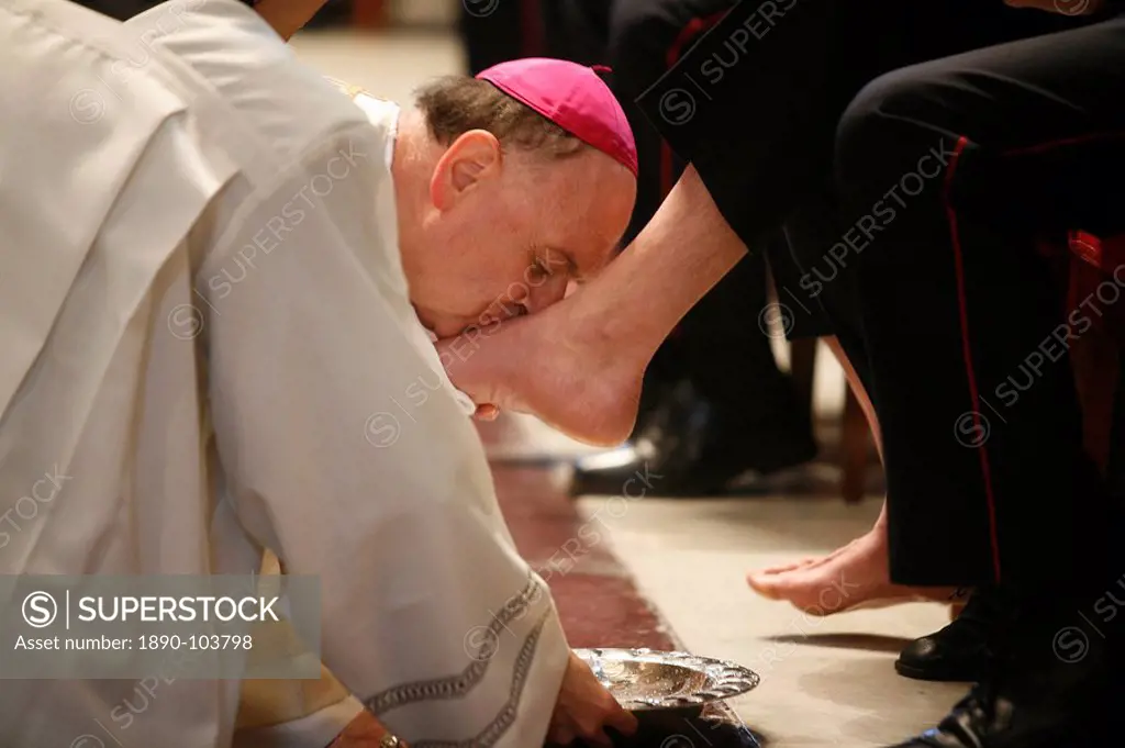 Bishop kissing feet after washing them, Easter Thursday Mass in St. Peter´s Basilica, Vatican, Rome, Lazio, Italy, Europe