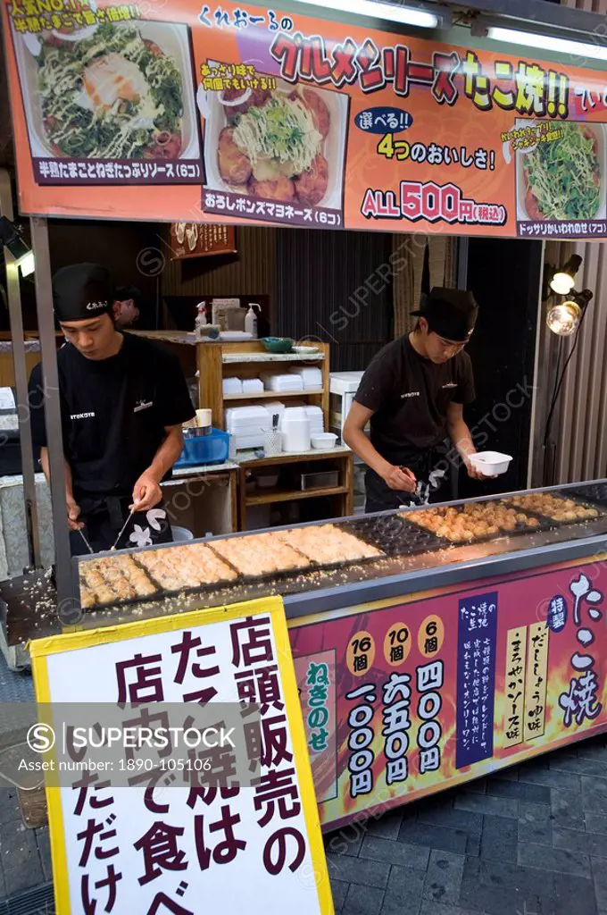 Takoyaki octopus balls stand in Dotonbori entertainment district of Namba, Osaka, Japan, Asia