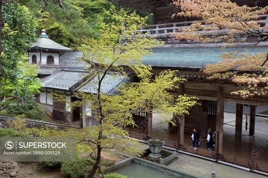 Monks inside main Sanmon Gate at Eiheiji Temple, headquarters of the Soto sect of Zen Buddhism, Fukui, Japan