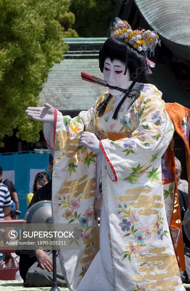 Man dressed as a woman performing classical Japanese dance called hobu at Meiji Jingu shrine, Tokyo, Japan, Asia