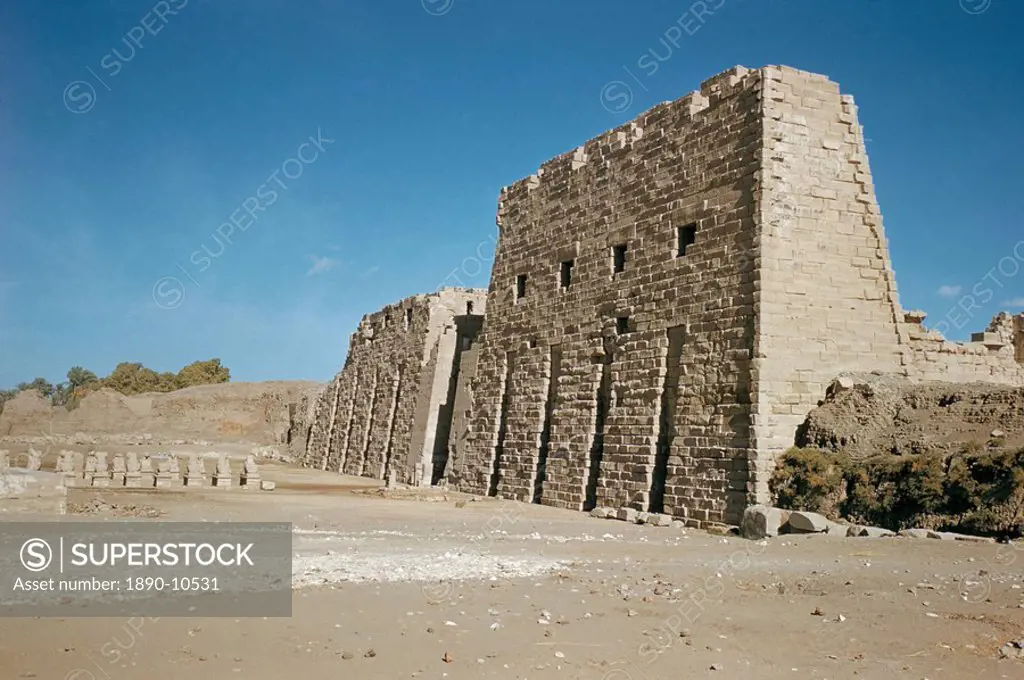 Entrance, west pylons, grooved to hold 8 flagstaffs, unfinished stonework, 142ft high, 372ft long, Ptolemaic period, Temple of Ammon, Karnak, Luxor, T...