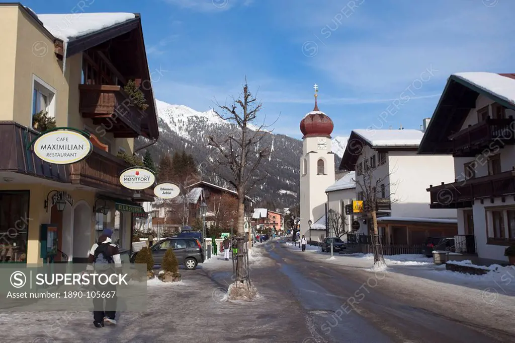 St. Anton am Arlberg main road and church in winter snow, Tyrol, Austrian Alps, Austria, Europe