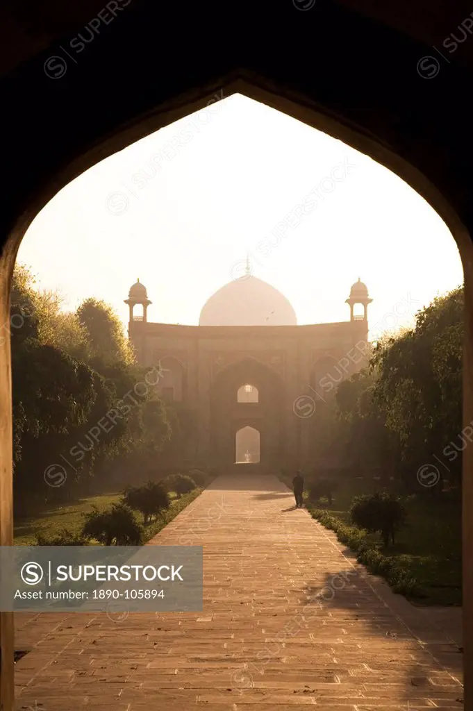 A man takes a morning walk in the Mughal era Humayan´s Tomb complex, UNESCO World Heritage Site, Delhi, India, Asia