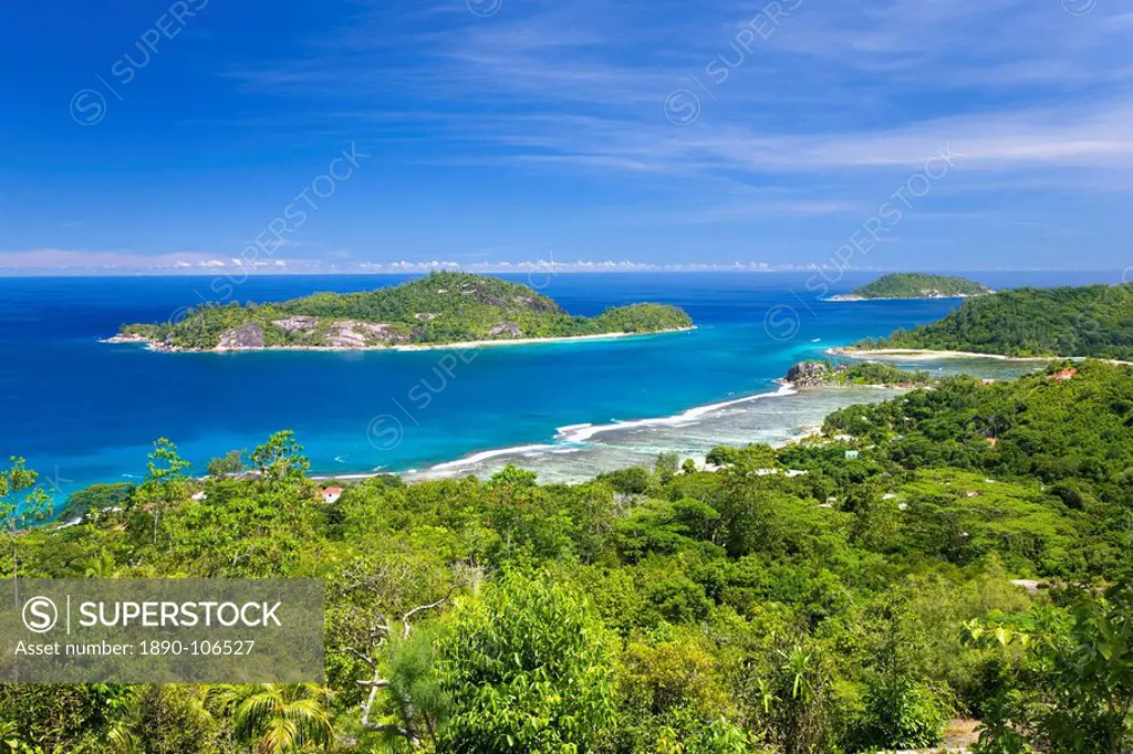 View across Anse l´Islette to the offshore islands of Therese and Conception from hillside above Port Glaud, Port Glaud district, Island of Mahe, Seyc...