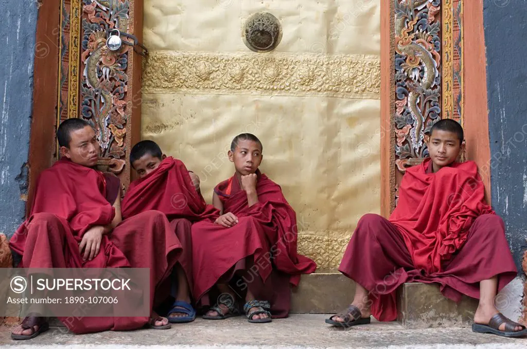 Young monks hanging out after praying, Punakha Tsong, an old fort, Bhutan, Asia