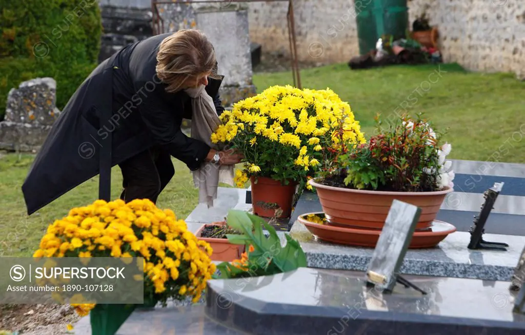 Woman in cemetery, Saint_Antonin_de_Sommaire, Eure, France, Europe