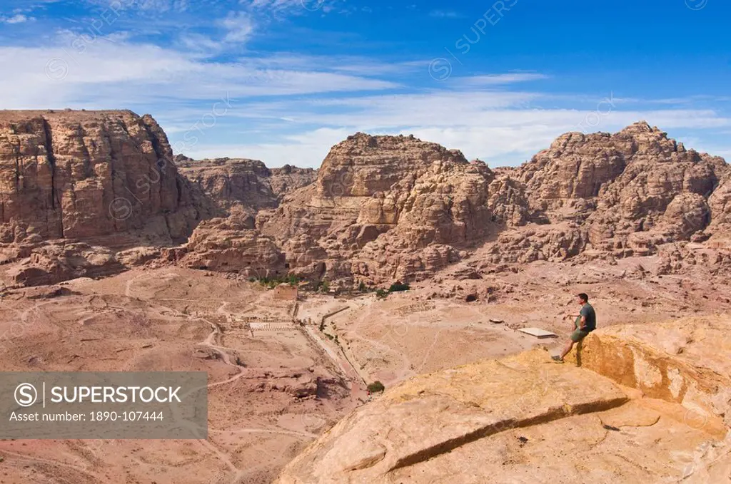 Traveller enjoying the view over Petra, UNESCO World Heritage Site, Jordan, Middle East