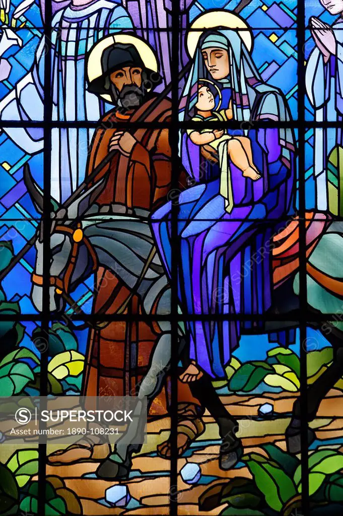 Stained glass window of the Flight into Egypt, in Chedde church, Haute Savoie, France, Europe