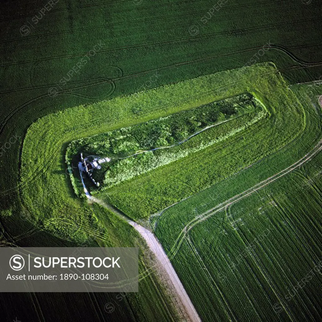 Aerial image of West Kennet Long Barrow, a Neolithic tomb or barrow, on a prominent chalk ridge, near Silbury Hill, Avebury, Wiltshire, England, Unite...