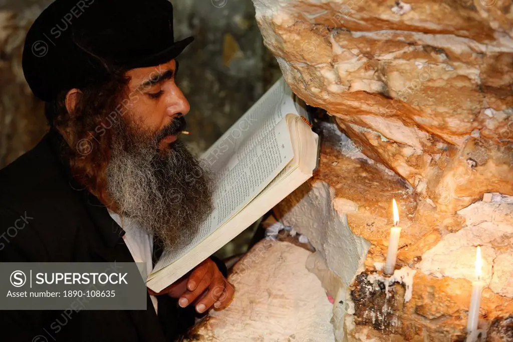 Woman praying in Elijah´s cave Synagogue in Haifa, Israel, Middle East