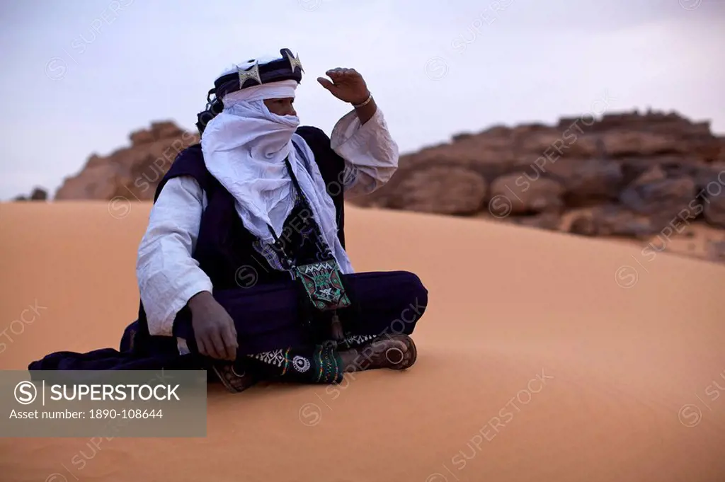 A Tuareg dressed for celebrations at the entrance of the Dar Sahara tented camp in the Fezzan desert, Libya, North Africa, Africa