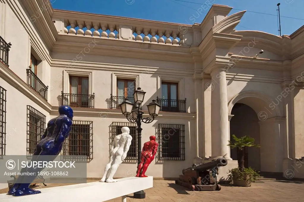 Cannon and modern art on display in an inner courtyard of the Palacio de La Moneda, formerly a colonial mint, now the seat of the President, Civic Dis...