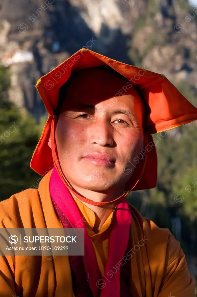 Yellow hat monk at the the famous Tigers Nest Taktshang Goempa monastery, Bhutan, Asia