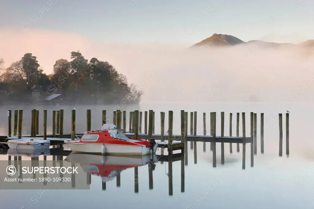 Tethered boats on Derwent Water on a misty autumn morning, Lake District National Park, Cumbria, England, United Kingdom, Europe