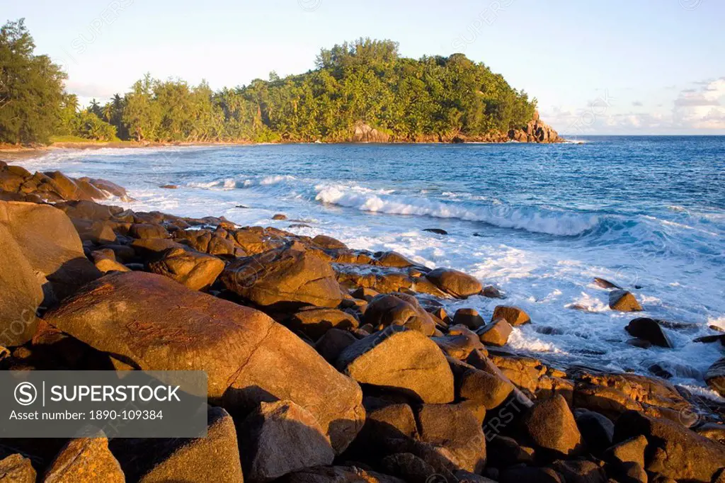 Rocky coast at sunset, Anse Bazarca, Takamaka district, Island of Mahe, Seychelles, Indian Ocean, Africa