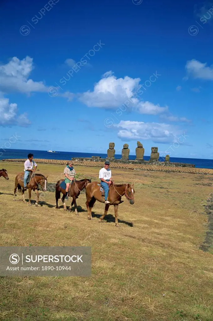 Tourists on horseback touring sites of moai or statues, at Ahu Vai Uri on Easter Island Rapa Nui, Chile, Pacific, South America