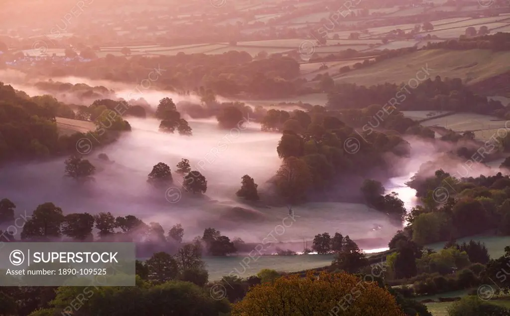 Mist lingers in the Usk Valley at dawn in autumn, Brecon Beacons National Park, Powys, Wales, United Kingdom, Europe