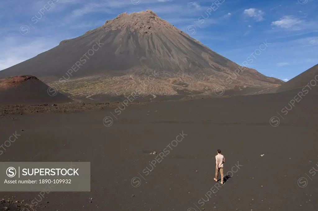 Man walking towards volcano on Fogo, Cape Verde Islands, Africa
