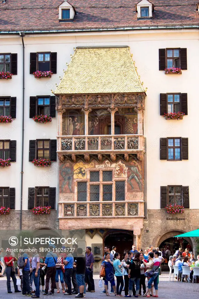 Tourists at Goldenes Dachl (Golden Roof), built in 1500 of gilded copper in Herzog Friedrich Strasse, Innsbruck, the Tyrol, Austria, Europe